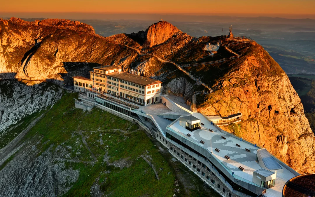 Pilatus Kulm Hotel at sunrise above the clouds in Switzerland