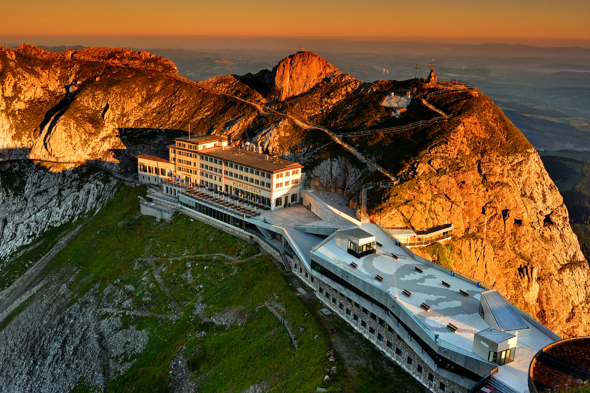 Pilatus Kulm Hotel – Sunrise Pilatus Kulm Hotel at sunrise above the clouds in Switzerland