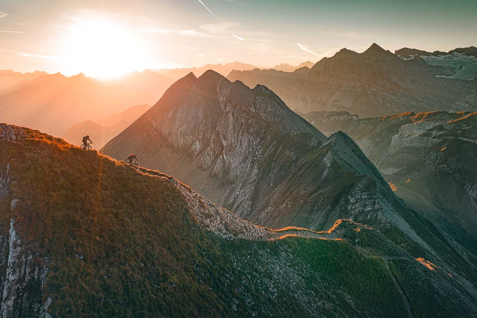 Mountain Biking at Mount Titlis Mountain bikers riding alpine trails at Mount Titlis in Central Switzerland